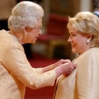 HRM Queen Elizabeth bestowing the OBE
